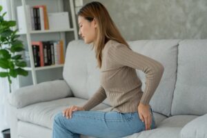 Woman experiencing hemorrhoid pain